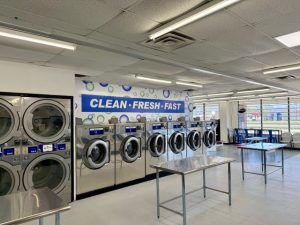 Large-capacity washers in a sleek, airy space.