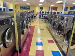 Soap Box in Birmingham, AL, shines with a lively facade, bright signs, and ample parking for the best laundromat experience in Alabama.

